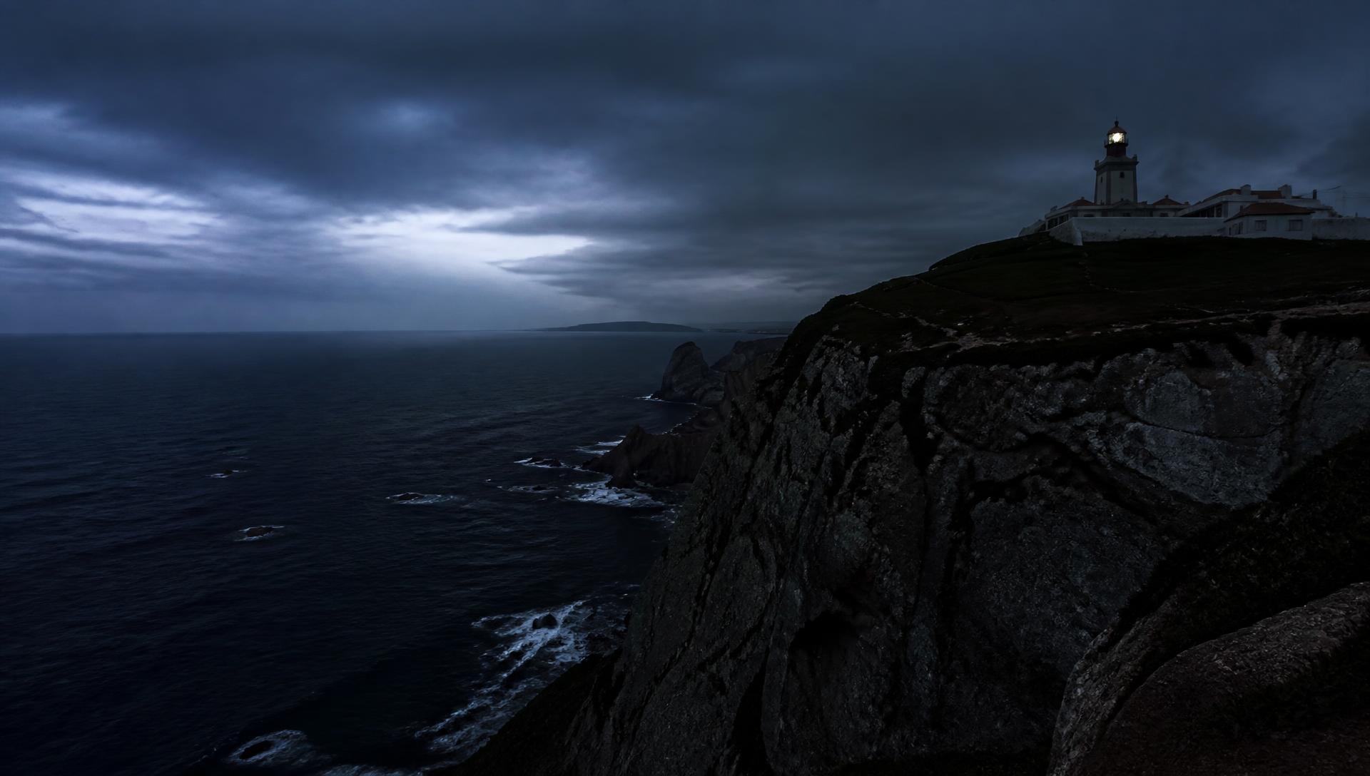Cliffs at Cabo da Roca meeting the Atlantic Ocean at blue hour